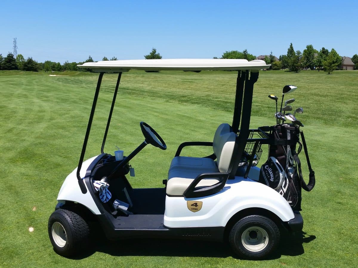 A golf cart parked on a fairway